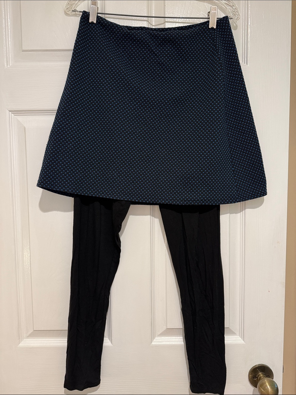 Fat Hat Clothing spantaloons black with blue polka dot skirt and black leggings.